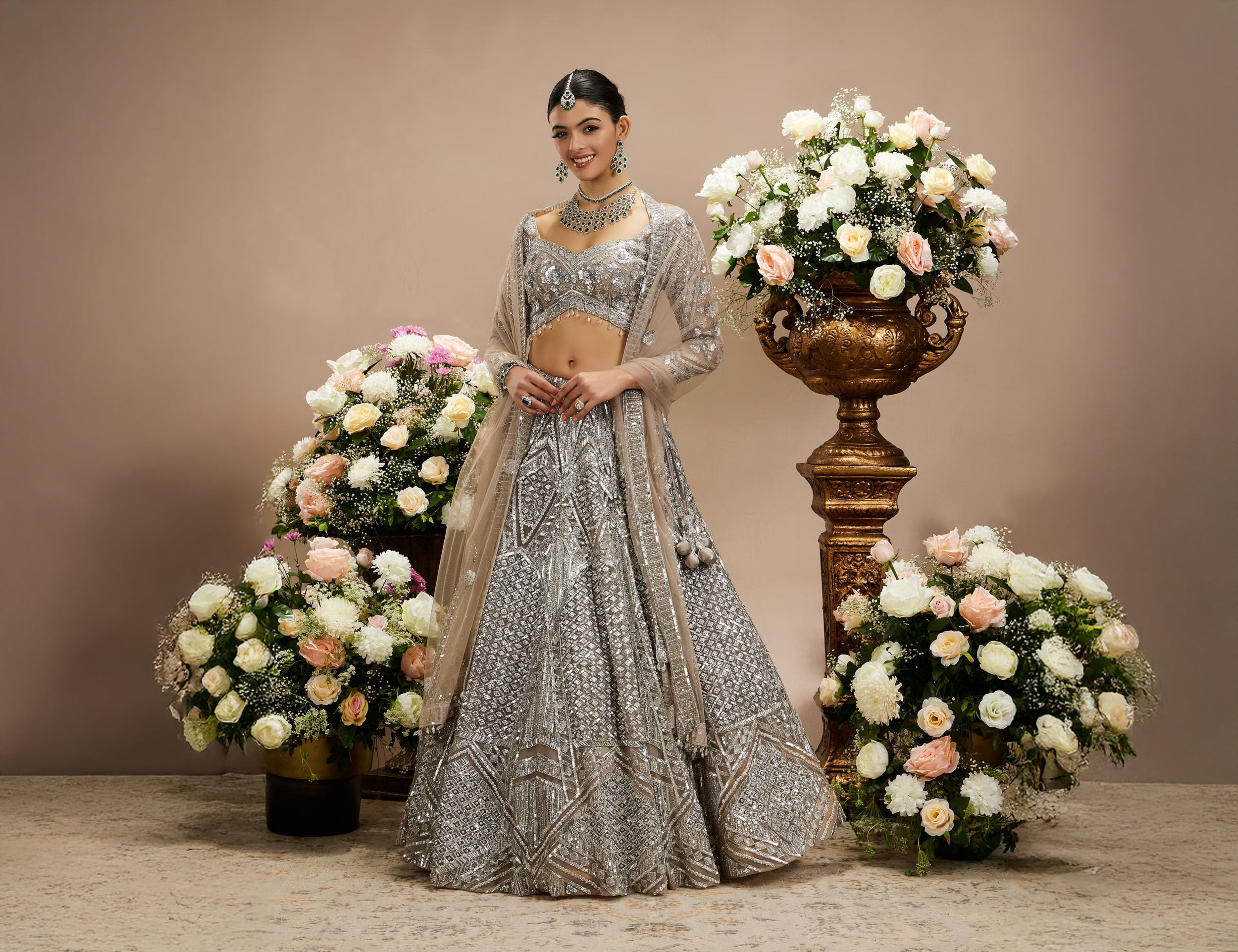 women wearing Lehenga adorned with sequins, offering a shimmering metallic accent.